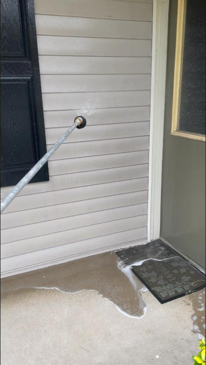 Vinyl siding soft-washed with an extension wand