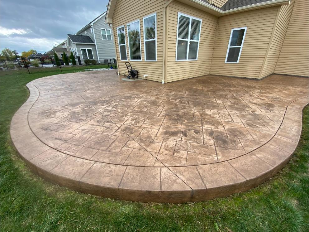 Stamped concrete patio washed and sealed at a Rochester-area home